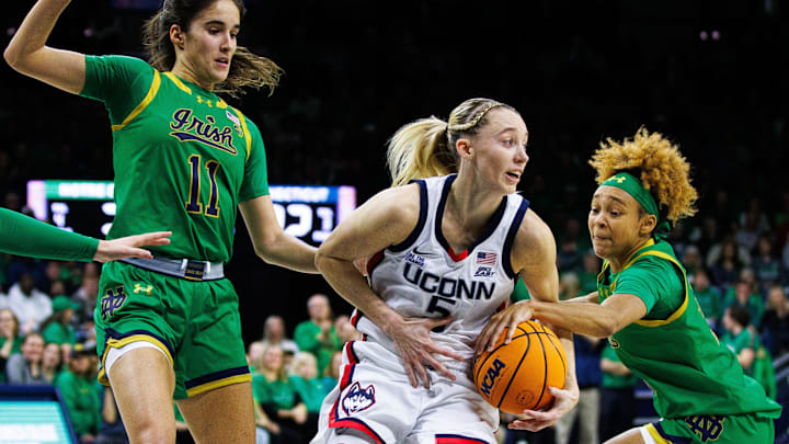 Notre Dame guard Hannah Hidalgo, right, attempts to steal the ball from UConn guard Paige Bueckers (5) during a NCAA women's basketball game between No. 8 Notre Dame and No. 2 UConn at Purcell Pavilion on Thursday, Dec. 12, 2024, in South Bend. Notre Dame guard Hannah Hidalgo, right, attempts to steal the ball from UConn guard Paige Bueckers (5) during a NCAA women's basketball game between No. 8 Notre Dame and No. 2 UConn at Purcell Pavilion on Thursday, Dec. 12, 2024, in South Bend.