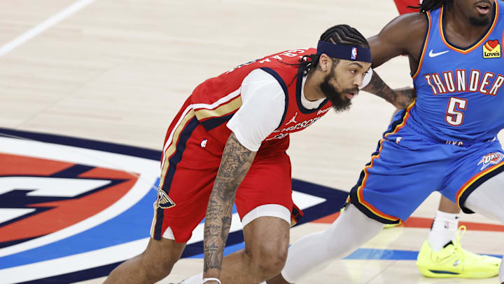 Apr 24, 2024; Oklahoma City, Oklahoma, USA; New Orleans Pelicans forward Brandon Ingram (14) drives to the basket beside Oklahoma City Thunder guard Luguentz Dort (5) during the first quarter during game two of the first round for the 2024 NBA playoffs at Paycom Center. Mandatory Credit: Alonzo Adams-USA TODAY Sports