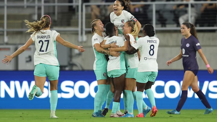 Teammates celebrate after Kansas City Current midfielder Vanessa DiBernardo (16) scores a goal against Racing Louisville FC in the second half at Lynn Family Stadium