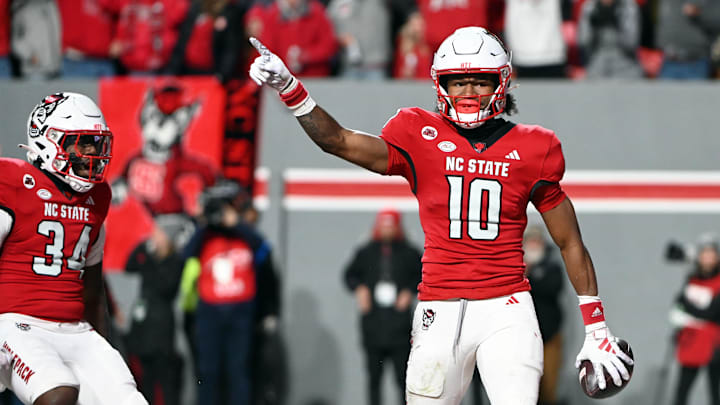 Nov 25, 2023; Raleigh, North Carolina, USA; North Carolina State Wolfpack receiver KC Concepcion (10) reacts after scoring a touchdown against the North Carolina Tar Heels during the first half at Carter-Finley Stadium. Mandatory Credit: Rob Kinnan-Imagn Images Nov 25, 2023; Raleigh, North Carolina, USA; North Carolina State Wolfpack receiver KC Concepcion (10) reacts after scoring a touchdown against the North Carolina Tar Heels during the first half at Carter-Finley Stadium. Mandatory Credit: Rob Kinnan-Imagn Images