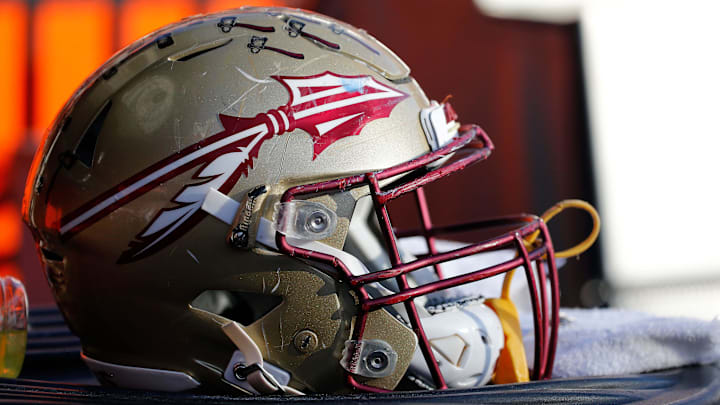Nov 25, 2017; Gainesville, FL, USA; Florida State Seminoles helmet lays on the field against the Florida Gators during the second half at Ben Hill Griffin Stadium. Mandatory Credit: Kim Klement-Imagn Images