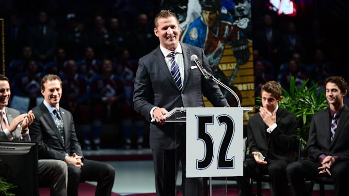 Nov 2, 2013; Denver, CO, USA; Colorado Avalanche former defenseman Adam Foote reacts during his jersey retirement ceremony before the game against the Montreal Canadiens at Pepsi Center. Mandatory Credit: Ron Chenoy-Imagn Images