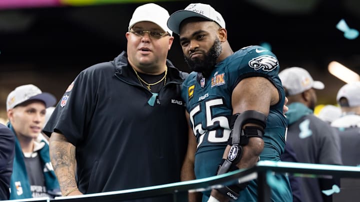 Philadelphia Eagles defensive end Brandon Graham (55) with team security guard Dom DiSandro after defeating the Kansas City Chiefs during Super Bowl LIX at Ceasars Superdome.
