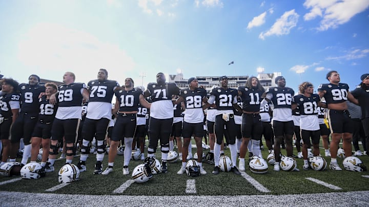 Sep 27, 2025; Nashville, Tennessee, USA;  Vanderbilt Commodores stands and sings to the crowd against the Utah State Aggies after the game at FirstBank Stadium. Mandatory Credit: Steve Roberts-Imagn Images