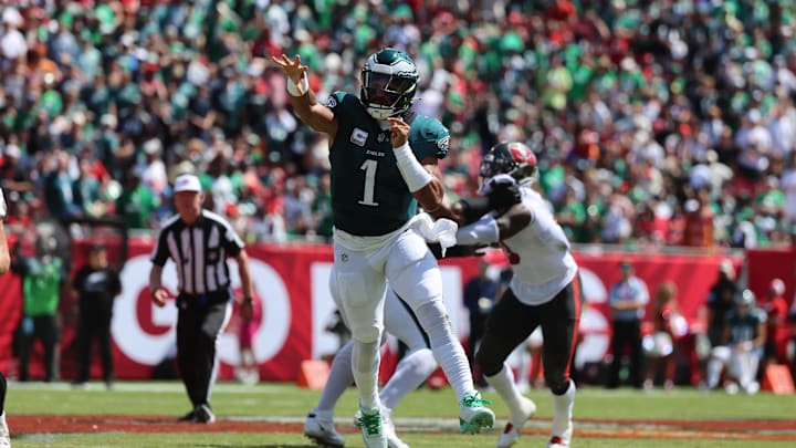 Sep 29, 2024; Tampa, Florida, USA; Philadelphia Eagles quarterback Jalen Hurts (1) throws the ball against the Tampa Bay Buccaneers during the first half at Raymond James Stadium. Mandatory Credit: Kim Klement Neitzel-Imagn Images