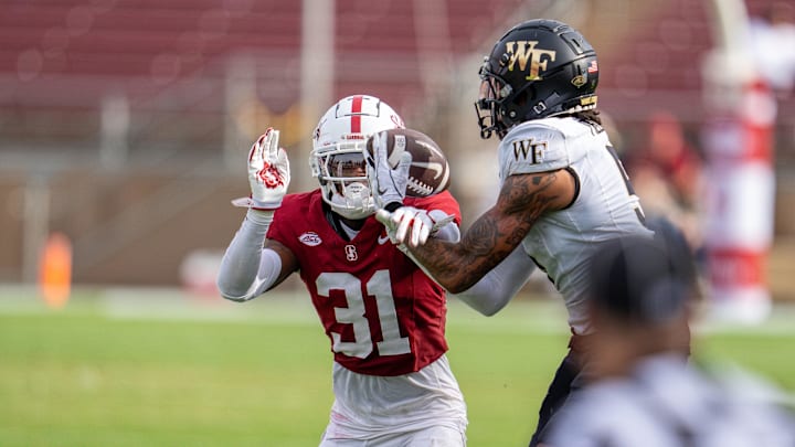 Oct 26, 2024; Stanford, California, USA;  Stanford Cardinal cornerback Aaron Morris (31) breaks up a pass to Wake Forest Demon Deacons wide receiver Horatio Fields (5) during the third quarter at Stanford Stadium. Mandatory Credit: Neville E. Guard-Imagn Images