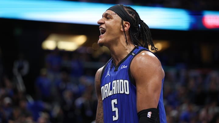 Apr 15, 2025; Orlando, Florida, USA;  Orlando Magic forward Paolo Banchero (5) reacts after a play against the Atlanta Hawks in the fourth quarter at Kia Center. Mandatory Credit: Nathan Ray Seebeck-Imagn Images