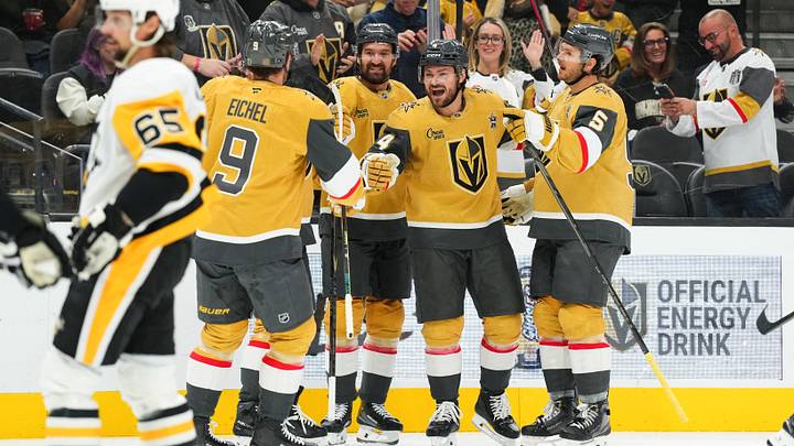 Vegas Golden Knights' Rasmus Andersson (4) celebrates his first-period goal with teammates during the game against the Pittsburgh Penguins at T-Mobile Arena.  Mandatory Credit: Candice Ward-Imagn Images