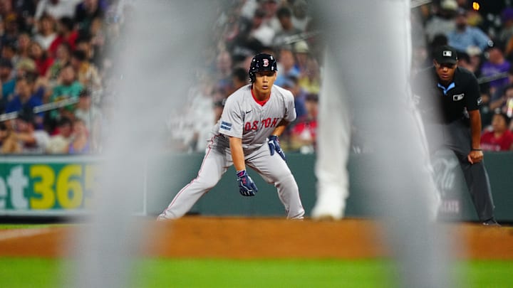 Jul 23, 2024; Denver, Colorado, USA; Boston Red Sox outfielder Masataka Yoshida (7) leans off base in the seventh inning against the Colorado Rockies at Coors Field. Mandatory Credit: Ron Chenoy-USA TODAY Sports