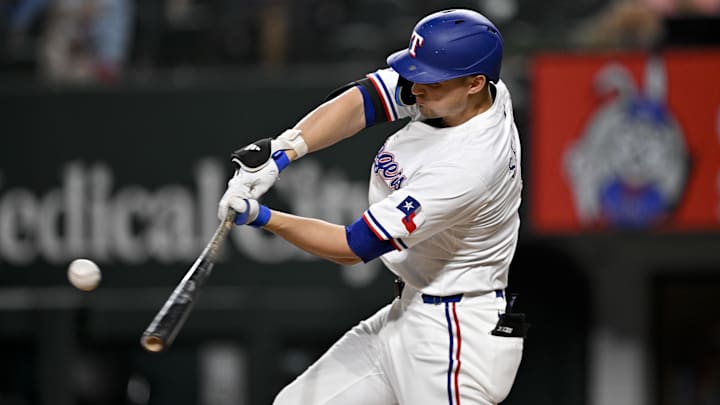 Aug 11, 2025; Arlington, Texas, USA; Texas Rangers shortstop Corey Seager (5) hits a double and drives in a run against the Arizona Diamondbacks during the third inning at Globe Life Field. Aug 11, 2025; Arlington, Texas, USA; Texas Rangers shortstop Corey Seager (5) hits a double and drives in a run against the Arizona Diamondbacks during the third inning at Globe Life Field.