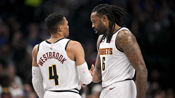 Jan 14, 2025; Dallas, Texas, USA; Denver Nuggets guard Russell Westbrook (4) and center DeAndre Jordan (6) talk during the second quarter against the Dallas Mavericks at the American Airlines Center. Mandatory Credit: Jerome Miron-Imagn Images
