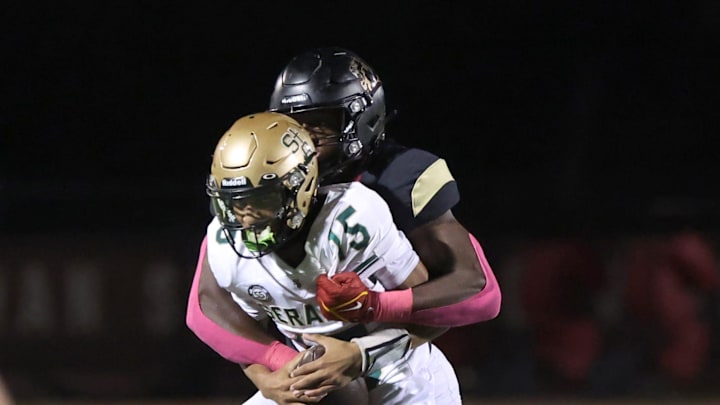 Oaks Christian's Hayden Lowe brings down St. Bonaventure's quarterback Jaxson Carper during the second quarter of Oaks Christian's 35-0 Marmonte League win over visiting St. Bonaventure Friday at Redell Field. Oaks Christian's Hayden Lowe brings down St. Bonaventure's quarterback Jaxson Carper during the second quarter of Oaks Christian's 35-0 Marmonte League win over visiting St. Bonaventure Friday at Redell Field.