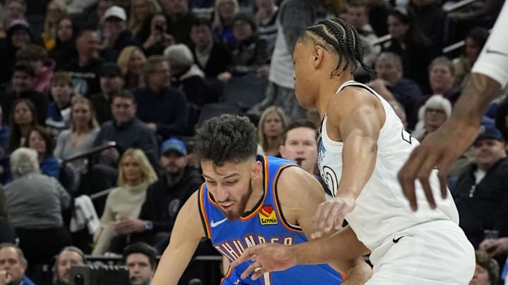 Feb 13, 2025; Minneapolis, Minnesota, USA; Oklahoma City Thunder center Chet Holmgren (7) works around Minnesota Timberwolves guard Jaylen Clark (22) in the first quarter at Target Center. Mandatory Credit: Bruce Kluckhohn-Imagn Images