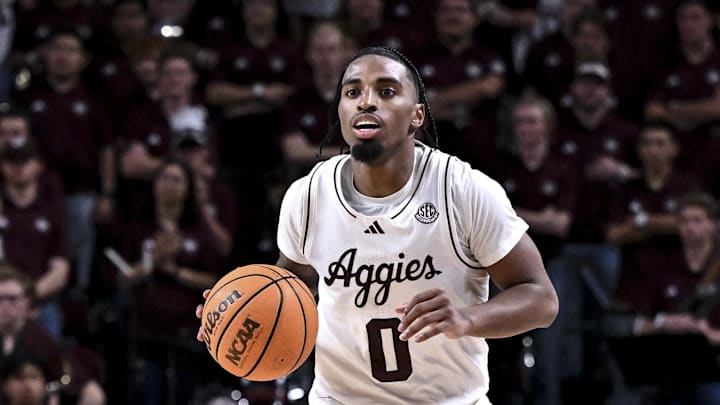 Feb 28, 2026; College Station, Texas, USA; Texas A&M Aggies guard Marcus Hill (0) dribbles the ball during the second half against the Texas Longhorns at Reed Arena. Mandatory Credit: Maria Lysaker-Imagn Images 