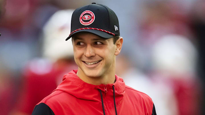 Jan 5, 2025; Glendale, Arizona, USA; San Francisco 49ers injured quarterback Brock Purdy prior to the game against the Arizona Cardinals at State Farm Stadium. Mandatory Credit: Mark J. Rebilas-Imagn Images