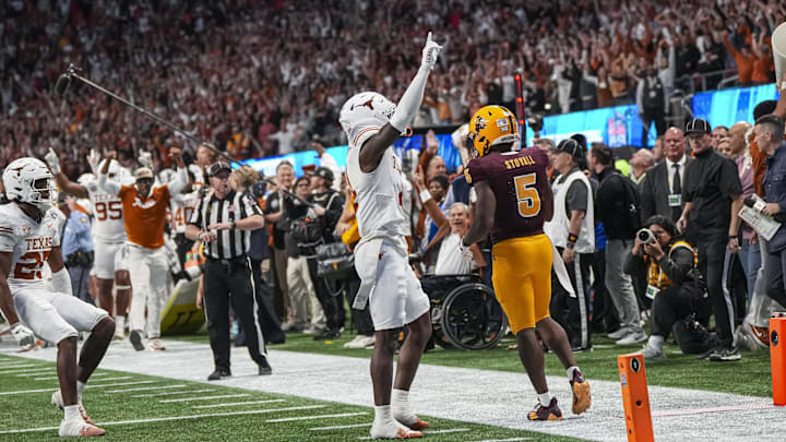 Jan 1, 2025; Atlanta, GA, USA; Texas Longhorns defensive back Andrew Mukuba (4) reacts after intercepting a pass against the Arizona State Sun Devils to end the game in the second overtime at Mercedes-Benz Stadium. Jan 1, 2025; Atlanta, GA, USA; Texas Longhorns defensive back Andrew Mukuba (4) reacts after intercepting a pass against the Arizona State Sun Devils to end the game in the second overtime at Mercedes-Benz Stadium.