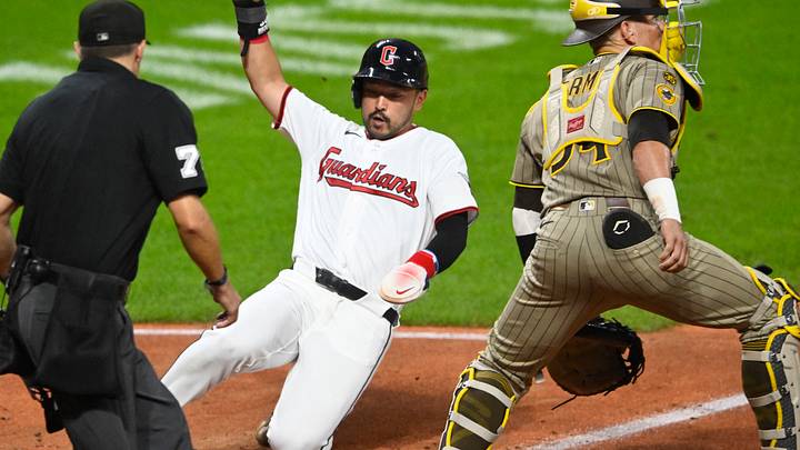 Aug 15, 2026; Cleveland, Ohio, USA; Cleveland Guardians left fielder Steven Kwan (38) scores beside San Diego Padres catcher Freddy Fermin (54) in the fifth inning at Progressive Field. Mandatory Credit: David Richard-Imagn Images Aug 15, 2026; Cleveland, Ohio, USA; Cleveland Guardians left fielder Steven Kwan (38) scores beside San Diego Padres catcher Freddy Fermin (54) in the fifth inning at Progressive Field. Mandatory Credit: David Richard-Imagn Images