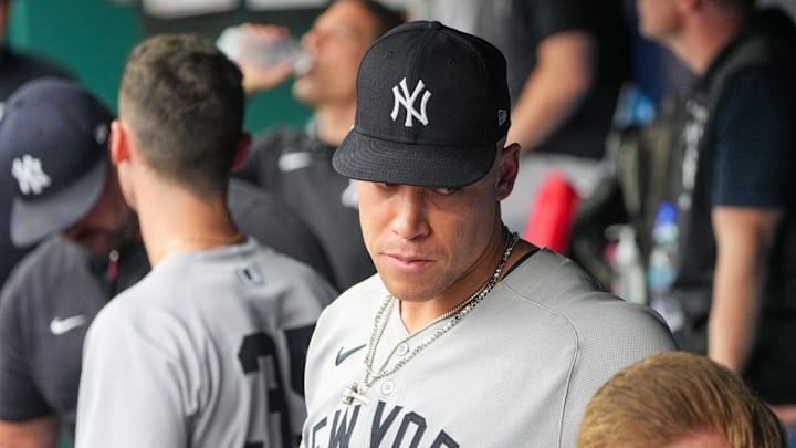 Kansas City, Missouri, USA; New York Yankees right fielder Aaron Judge (99) looks on in the dugout against the Kansas City Royals during the third inning at Kauffman Stadium.