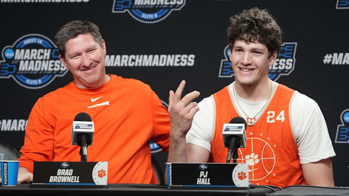 Mar 29, 2024; Los Angeles, CA, USA; Clemson Tigers coach Brad Brownell (left) and center PJ Hall.