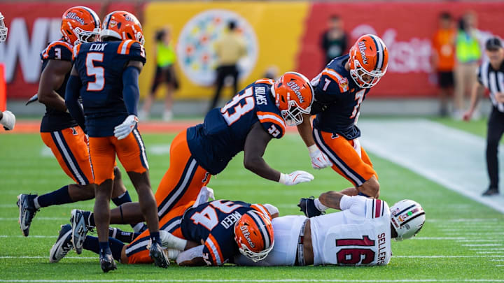 Illinois linebacker Ryan Meed (34) and a host of teammates on the Illini defense take down South Carolina quarterback LaNorris Sellers in Illinois' 21-17 win over the Gamecocks in the Citrus Bowl in Orlando, Florida, on New Year's Eve. Illinois linebacker Ryan Meed (34) and a host of teammates on the Illini defense take down South Carolina quarterback LaNorris Sellers in Illinois' 21-17 win over the Gamecocks in the Citrus Bowl in Orlando, Florida, on New Year's Eve.