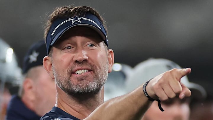Dallas Cowboys offensive coordinator Brian Schottenheimer coaches during warm-ups before a game against the New York Giants.