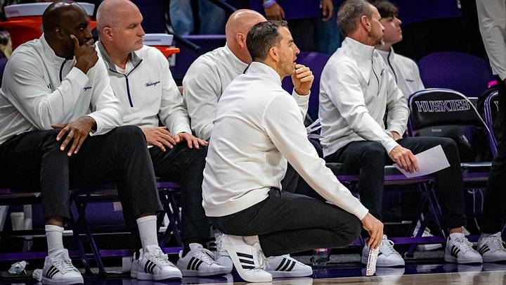 Danny Sprinkle is shown last season, surrounded by his Husky assistant coaches. 
