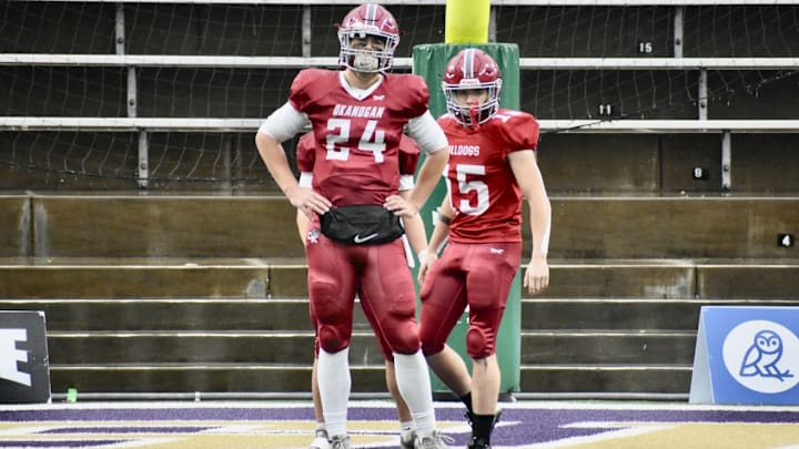 Okanogan, led by quarterback Carter Kuchenbuch, defended its WIAA Class 2B championship Saturday against Napavine in Husky Stadium.