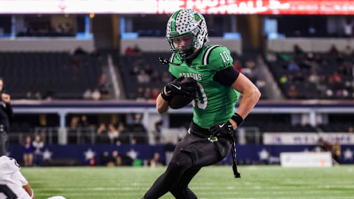 Southlake Carroll wide receiver Brody Knowles looks for running room after a catch in the Class 6A Division II finals in Arlington, Texas.
