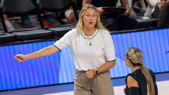 Nebraska assistant coach Kelly (Hunter) Natter confers with libero Laney Choboy during the AVCA First Serve. Natter, Jaylen Reyes and Brennan Hagar will return for their second year under Dani Busboom Kelly