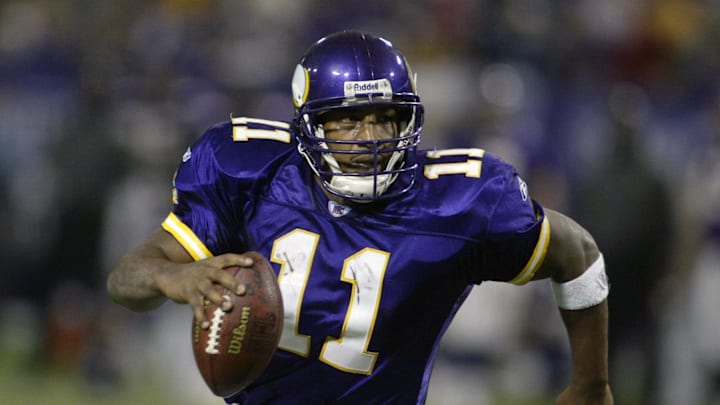 Nov 21, 2004; Minneapolis, MN, USA; Minnesota Vikings quarterback #11 Daunte Culpepper runs to the one-yard line against the Detroit Lions defense in 2nd half action at the Metrodome. The Vikings won 22-19. Mandatory Credit: Photo By Bruce Kluckhohn-Imagn Images Copyright (c) 2004 Bruce Kluckhohn

