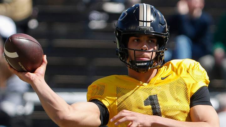 Purdue Boilermakers quarterback Evans Chuba (1) throws the football. Purdue Boilermakers quarterback Evans Chuba (1) throws the football.