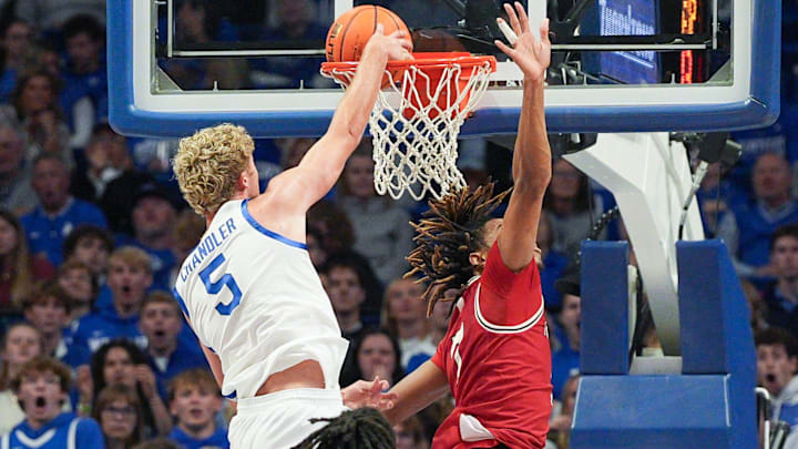 Kentucky Wildcats guard Collin Chandler (5) dunks over Nicholls Colonels forward Grant Sanders (7) in the second half at Rupp Arena in Lexington, Kentucky Nov. 4, 2025.