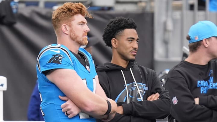 Oct 26, 2025; Charlotte, North Carolina, USA; Carolina Panthers quarterback Andy Dalton (14) and quarterback Bryce Young (9) on the sideline during the second half against the Buffalo Bills at Bank of America Stadium. Mandatory Credit: Jim Dedmon-Imagn Images Oct 26, 2025; Charlotte, North Carolina, USA; Carolina Panthers quarterback Andy Dalton (14) and quarterback Bryce Young (9) on the sideline during the second half against the Buffalo Bills at Bank of America Stadium. Mandatory Credit: Jim Dedmon-Imagn Images