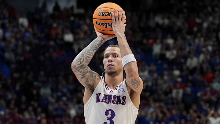 Nov 11, 2025; Lawrence, Kansas, USA; Kansas Jayhawks guard Tre White (3) shoots a free throw during the second half against the Texas A&M-Corpus Christi Islanders at Allen Fieldhouse. Mandatory Credit: Jay Biggerstaff-Imagn Images