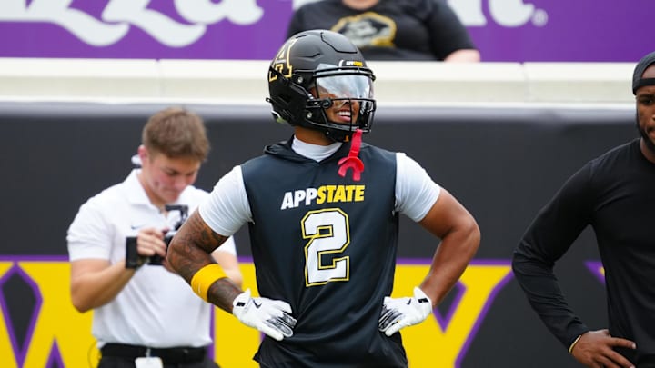 Sep 14, 2024; Greenville, North Carolina, USA; Appalachian State Mountaineers wide receiver Kaedin Robinson (2) looks on before the game during the warmups against the East Carolina Pirates at Dowdy-Ficklen Stadium. Mandatory Credit: James Guillory-Imagn Images Sep 14, 2024; Greenville, North Carolina, USA; Appalachian State Mountaineers wide receiver Kaedin Robinson (2) looks on before the game during the warmups against the East Carolina Pirates at Dowdy-Ficklen Stadium. Mandatory Credit: James Guillory-Imagn Images