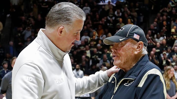 Purdue Boilermakers head coach Matt Painter and Gene Keady shake hands 
