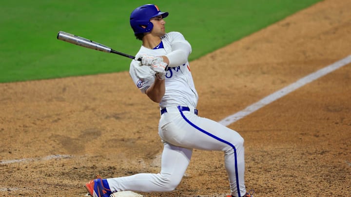 Florida utility Jac Caglianone (14) swings at a pitch during the sixth inning of an NCAA baseball