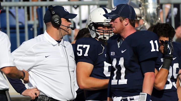 Former Penn State Nittany Lions head coach Bill O'Brien talks to quarterback Matthew McGloin on the sideline during a 2012 game at Beaver Stadium. 