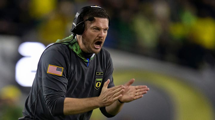 Oregon head coach Dan Lanning yells to his team.