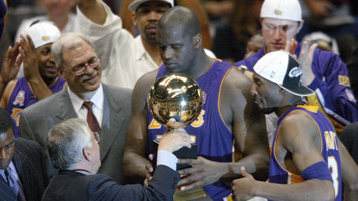 June 12, 2002; East Rutherford, NJ, USA; NBA commissioner David Stern hands Los Angeles Lakers Phil Jackson (left), Shaquille O'Neal (center) and Kobe Bryant (right) their championship trophy at the end of Game 4 of the NBA Finals at The Meadowlands. Mandatory Credit: Robert Deutsch-Imagn Images June 12, 2002; East Rutherford, NJ, USA; NBA commissioner David Stern hands Los Angeles Lakers Phil Jackson (left), Shaquille O'Neal (center) and Kobe Bryant (right) their championship trophy at the end of Game 4 of the NBA Finals at The Meadowlands. Mandatory Credit: Robert Deutsch-Imagn Images