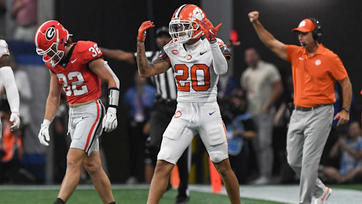 Aug 31, 2024; Atlanta, Georgia, USA; Clemson Tigers corner back Avieon Terrell (20) reacts after tackling Georgia Bulldogs running back Cash Jones (32) during the first quarter of the 2024 Aflac Kickoff Game at Mercedes-Benz Stadium. Mandatory Credit: Ken Ruinard-Imagn Images