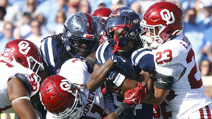 Mississippi Rebels running back Henry Parrish Jr. (21) runs the ball for a touchdown as Oklahoma Sooners linebacker Dasan McCullough (1) and defensive back Eli Bowen (23) attempt to make the tackle during last year's matchup.