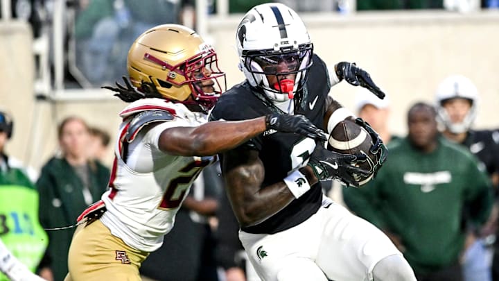 Michigan State's Nick Marsh, right, catches a touchdown pass as Boston College's Amari Jackson attempts to make the tackle during the first quarter on Saturday, Sept. 6, 2025, at Spartan Stadium in East Lansing.