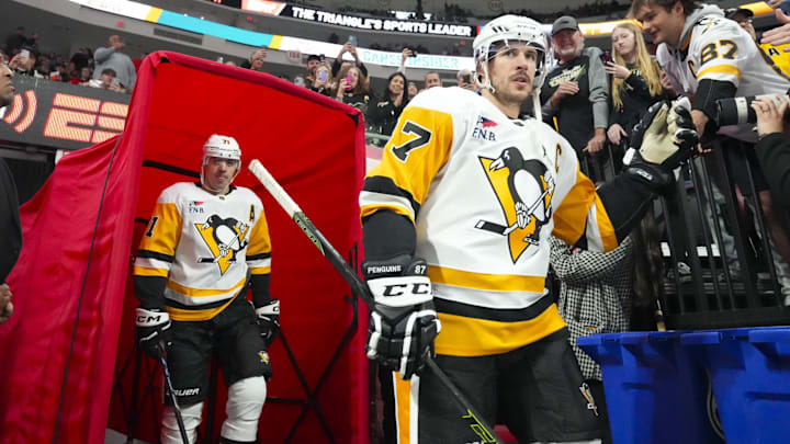 Nov 18, 2023; Raleigh, North Carolina, USA; Pittsburgh Penguins center Sidney Crosby (87) and center Evgeni Malkin (71) come out of the locker room for the warmups Carolina Hurricanes at PNC Arena. Mandatory Credit: James Guillory-Imagn Images Nov 18, 2023; Raleigh, North Carolina, USA; Pittsburgh Penguins center Sidney Crosby (87) and center Evgeni Malkin (71) come out of the locker room for the warmups Carolina Hurricanes at PNC Arena. Mandatory Credit: James Guillory-Imagn Images