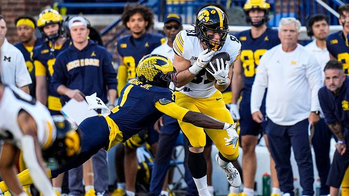 Michigan safety Rod Moore Jr. (1) tackles Iowa tight end DJ Vonnahme (81) during the second half at Michigan Stadium in Ann Arbor on Saturday, Sept. 26, 2026.