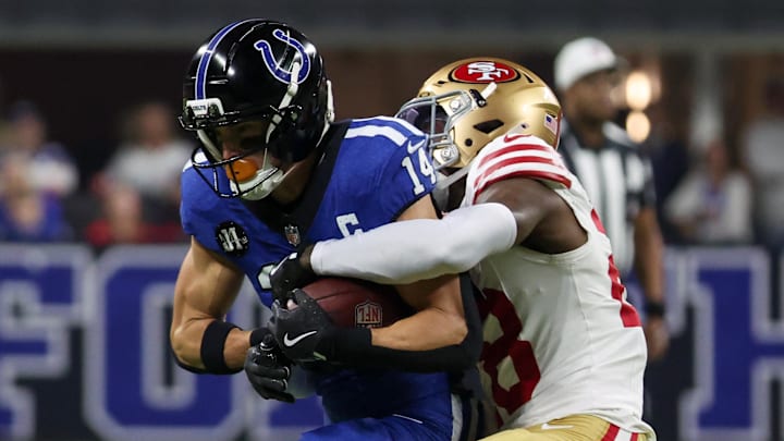 Dec 22, 2025; Indianapolis, Indiana, USA; Indianapolis Colts wide receiver Alec Pierce (14) makes a catch defended by San Francisco 49ers cornerback Darrell Luter Jr. (28) in the first quarter of the game at Lucas Oil Stadium. Mandatory Credit: Trevor Ruszkowski-Imagn Images