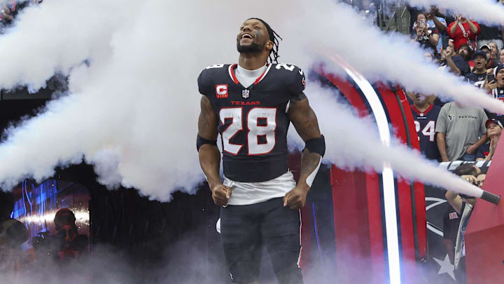 Dec 15, 2024; Houston Texans running back Joe Mixon (28) runs onto the field before the game against the Miami Dolphins at NRG Stadium. Mandatory Credit: Troy Taormina-Imagn Images