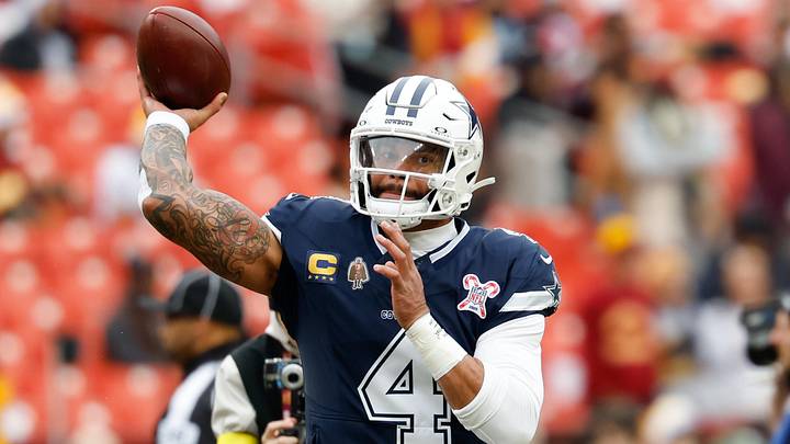 Dallas Cowboys quarterback Dak Prescott warms up before the game against the Washington Commanders. Dallas Cowboys quarterback Dak Prescott warms up before the game against the Washington Commanders.