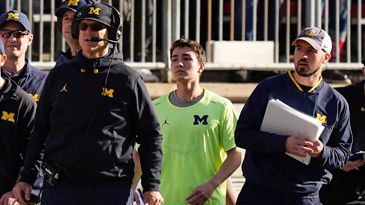 Nov 26, 2022; Columbus, Ohio, USA; Michigan Wolverines head coach Jim Harbaugh watches from the