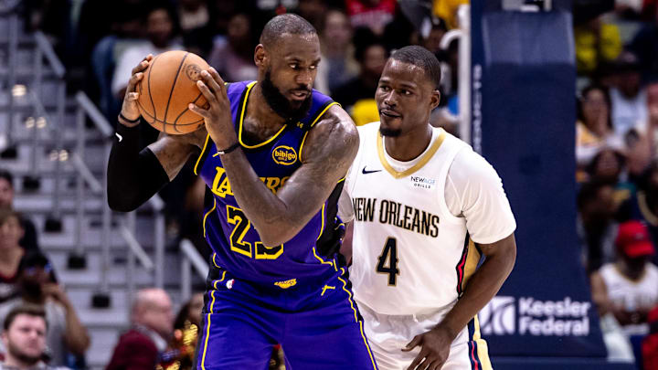Nov 16, 2024; New Orleans, Louisiana, USA: Los Angeles Lakers forward LeBron James (23) dribbles against New Orleans Pelicans guard Javonte Green (4) during the second half at Smoothie King Center. Mandatory Credit: Stephen Lew-Imagn Images